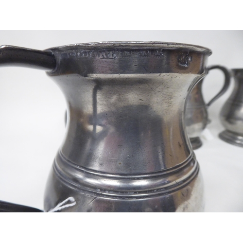 75 - Twelve similar 18th and 19thC pewter quart size (approx.) baluster shape mugs