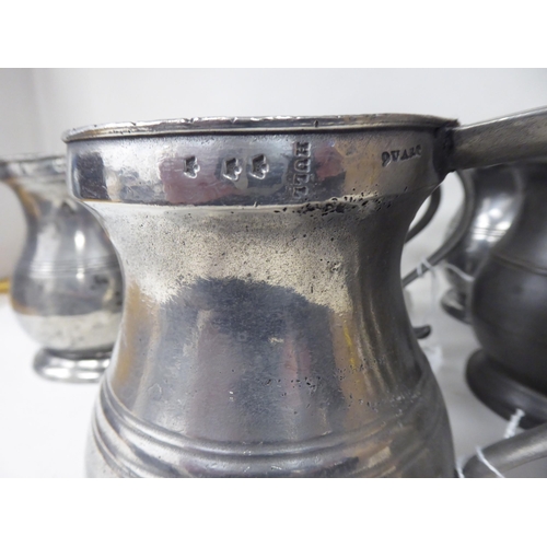 75 - Twelve similar 18th and 19thC pewter quart size (approx.) baluster shape mugs