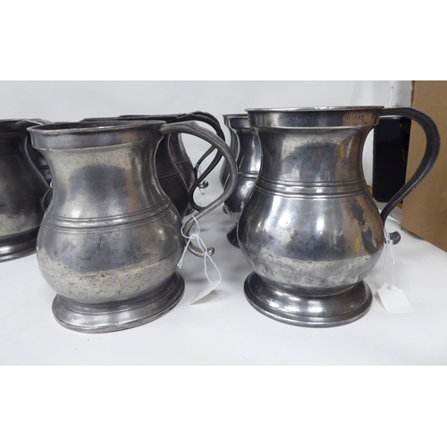 75 - Twelve similar 18th and 19thC pewter quart size (approx.) baluster shape mugs