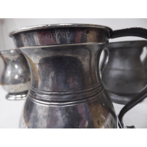 75 - Twelve similar 18th and 19thC pewter quart size (approx.) baluster shape mugs