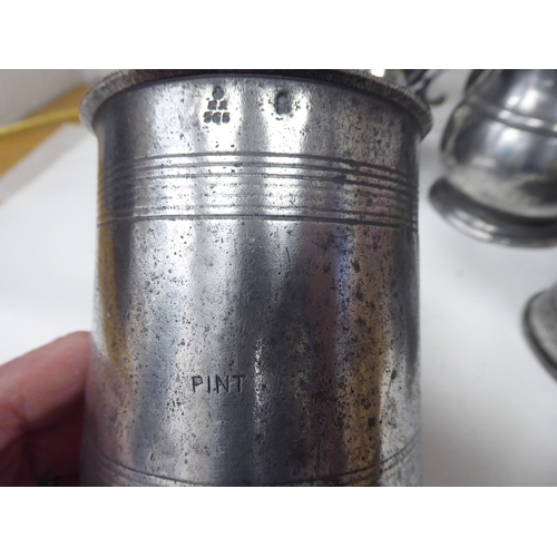 77 - Ten 17th and 18thC pewter mugs: to include quart size, pint and similar of varying designs