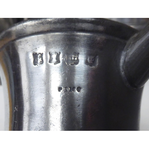 77 - Ten 17th and 18thC pewter mugs: to include quart size, pint and similar of varying designs