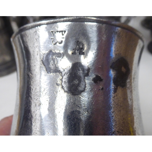 77 - Ten 17th and 18thC pewter mugs: to include quart size, pint and similar of varying designs