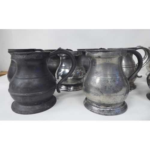 78 - Twelve similar 18th and 19thC pewter tankards/measures of waisted, baluster form