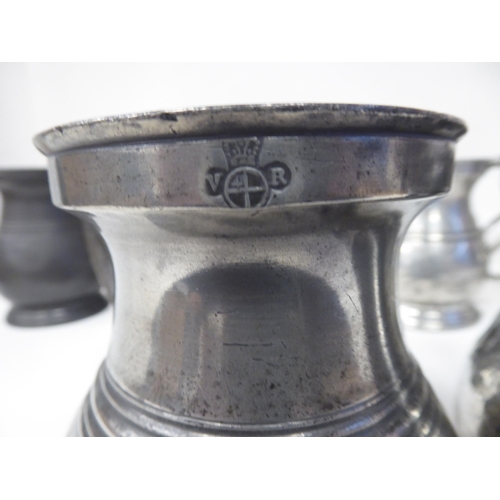 78 - Twelve similar 18th and 19thC pewter tankards/measures of waisted, baluster form