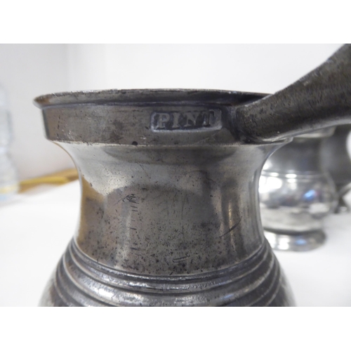 78 - Twelve similar 18th and 19thC pewter tankards/measures of waisted, baluster form