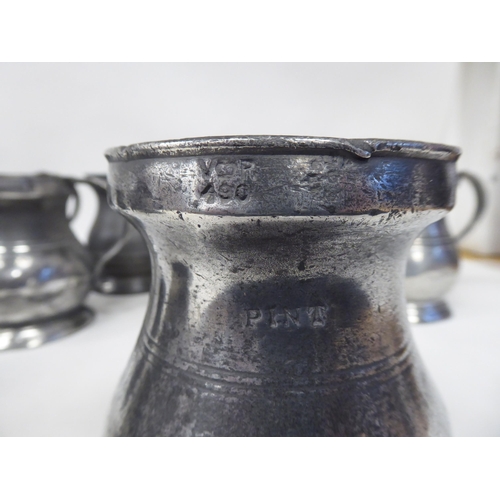 78 - Twelve similar 18th and 19thC pewter tankards/measures of waisted, baluster form