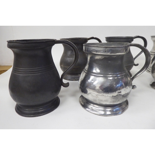 78 - Twelve similar 18th and 19thC pewter tankards/measures of waisted, baluster form