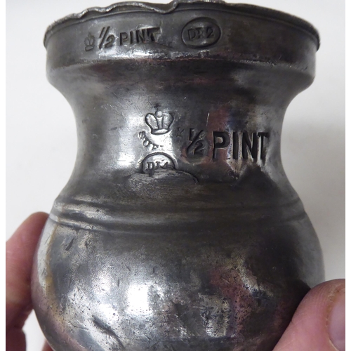 79 - Fourteen 17th and 18thC pewter, baluster shape measures  largest approx. one pint