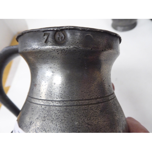 79 - Fourteen 17th and 18thC pewter, baluster shape measures  largest approx. one pint