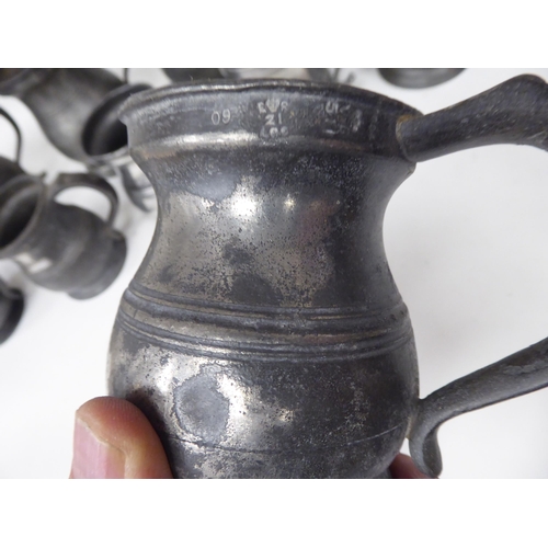 79 - Fourteen 17th and 18thC pewter, baluster shape measures  largest approx. one pint