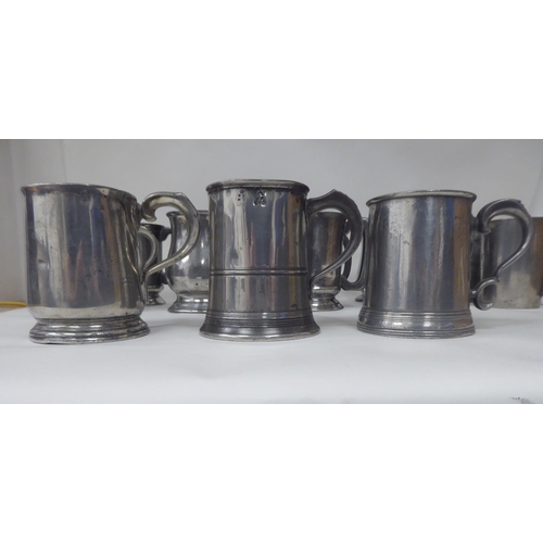 80 - Eighteen 18th and 19thC pewter mugs, one-two pints approx. of varying design