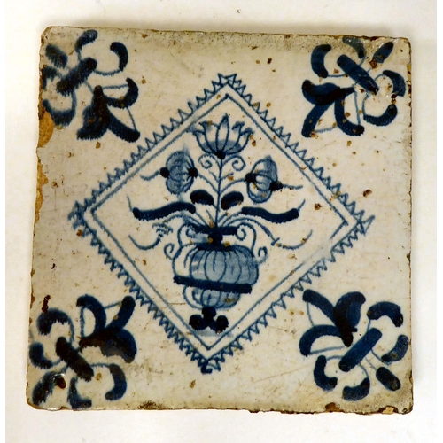 82 - Three dissimilar 18thC earthenware tiles, viz. one in blue and white and colours; another, in geomet... 