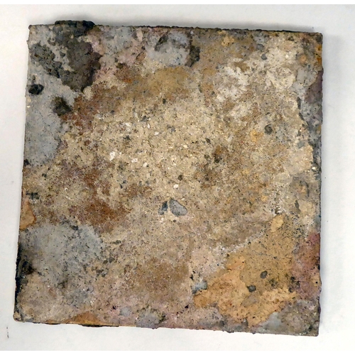 82 - Three dissimilar 18thC earthenware tiles, viz. one in blue and white and colours; another, in geomet... 