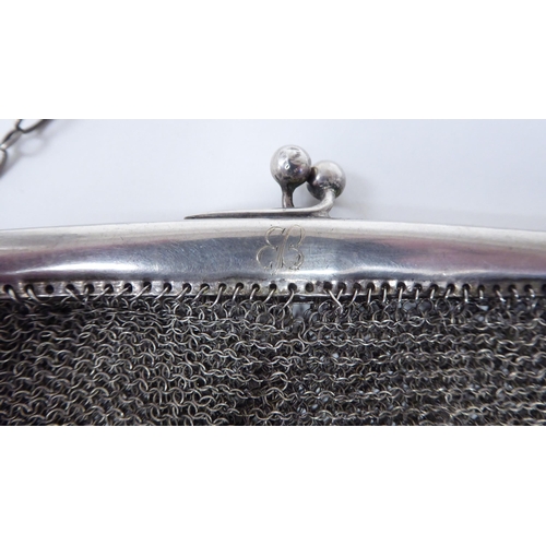 89 - An early 20thC German lady's white metal chain mail evening purse; and a contemporary white metal mo... 