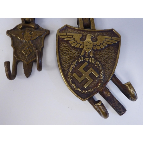 90 - A pair of German brass and brown hide drum hangers(Please Note: this lot is subject to the statement... 