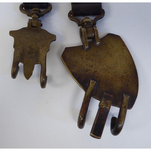 90 - A pair of German brass and brown hide drum hangers(Please Note: this lot is subject to the statement... 