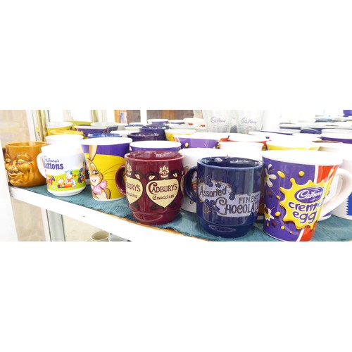 18 - Cadbury's promotional wares: to include china mugs; puzzles; diecast model vehicles; and other colle... 