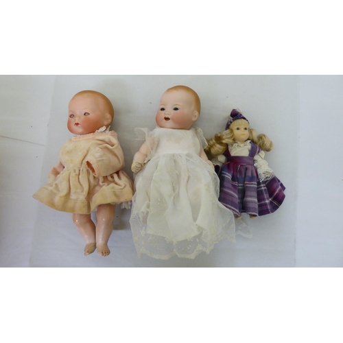 173 - Various composition dolls: to include two early 20thC Armand Marseille bisque head examples  10... 