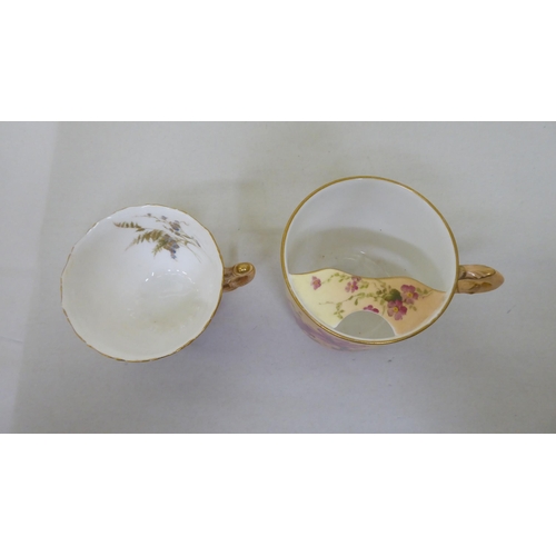 178 - A Royal Worcester china moustache cup and saucer; and another cup and saucer, date cyphers between 1... 