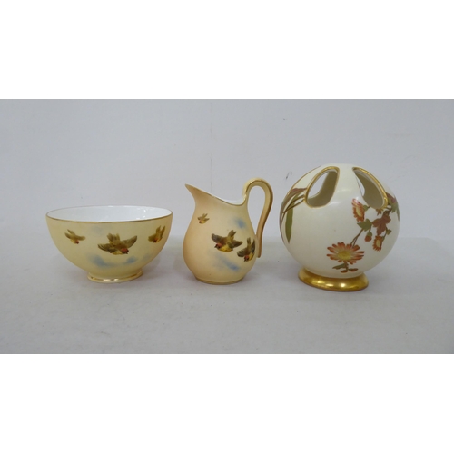 181 - Six items of Royal Worcester blush china collectables: to include a cream jug with gilded ornament, ... 