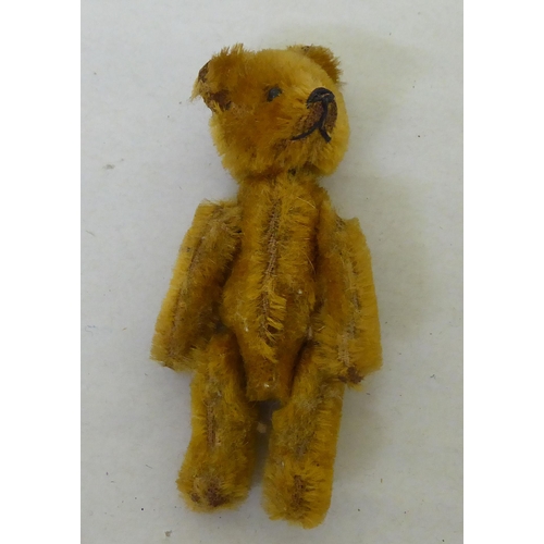 204 - A mixed lot: to include a Schuco Teddy bear perfume bottle  3.5