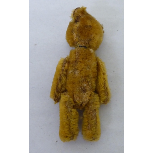 204 - A mixed lot: to include a Schuco Teddy bear perfume bottle  3.5