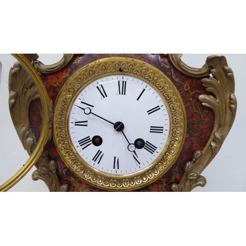 206 - A modern reproduction of an antique inspired faux boulle and tortoiseshell cased mantel clock with c... 