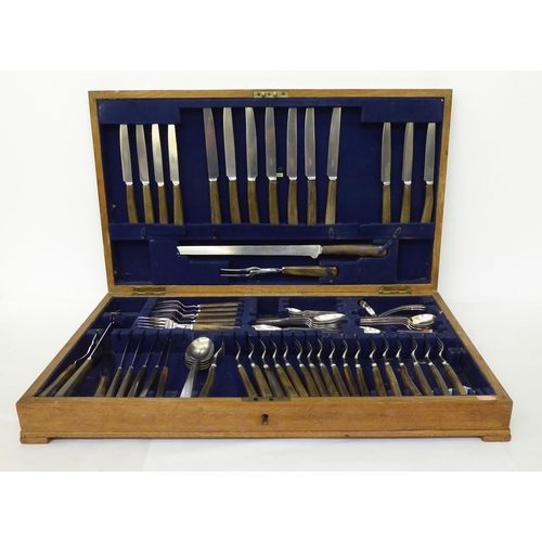 223 - A canteen of teak and horn handled EPNS and stainless steel cutlery and flatware, in a fitted oak ch... 