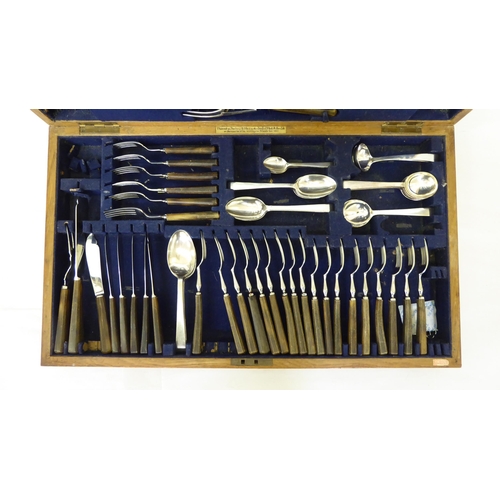 223 - A canteen of teak and horn handled EPNS and stainless steel cutlery and flatware, in a fitted oak ch... 