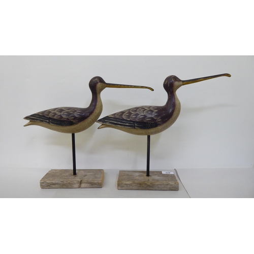 228 - A pair of carved and painted wooden curlews, on platform stands  13