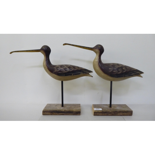 228 - A pair of carved and painted wooden curlews, on platform stands  13