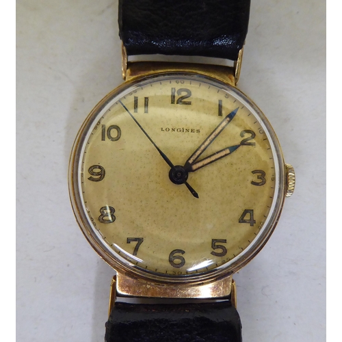 243 - A Longines 9ct gold cased wristwatch, faced by an Arabic dial with a seconds hand, on a dedicated bl... 