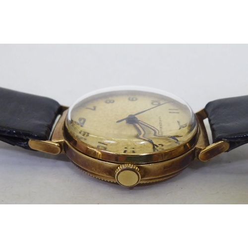 243 - A Longines 9ct gold cased wristwatch, faced by an Arabic dial with a seconds hand, on a dedicated bl... 