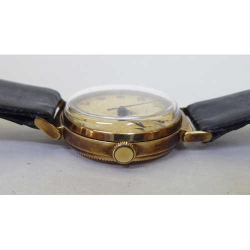 243 - A Longines 9ct gold cased wristwatch, faced by an Arabic dial with a seconds hand, on a dedicated bl... 