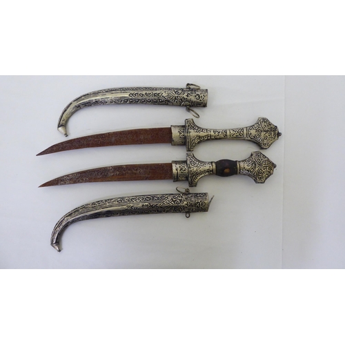 254 - Two Persian daggers, the curved blades 9