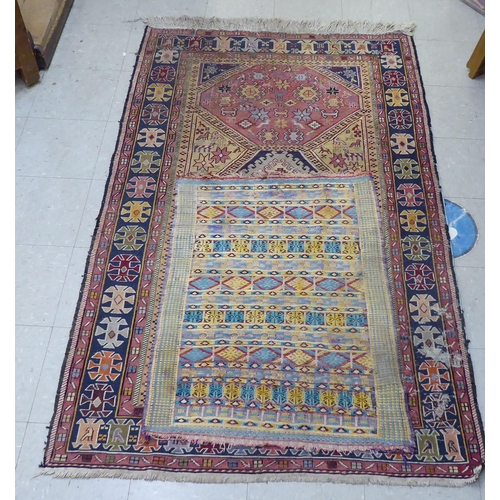 292 - A Kelim rug, decorated in geometric colours  23