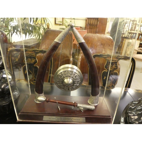 297 - A metal and mahogany presentation gong, in a perspex case  20