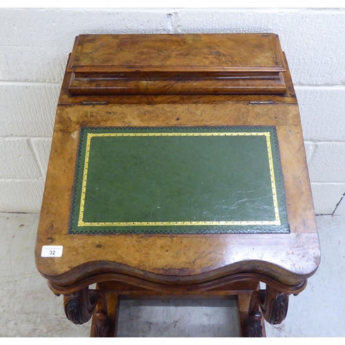 32 - WITHDRAWN A late Victorian walnut Davenport with a hinged lid and scrolled uprights, the side with f... 