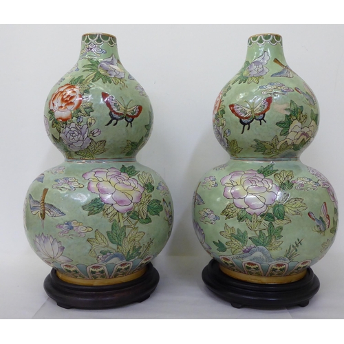 349 - A pair of modern Chinese porcelain, double gourd vases, decorated with animals and flowers  19