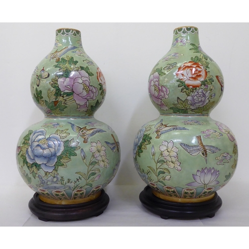 349 - A pair of modern Chinese porcelain, double gourd vases, decorated with animals and flowers  19