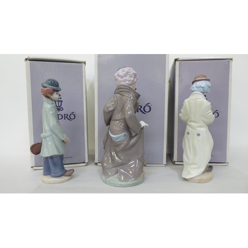 36 - Three Lladro porcelain figures, clowns in various poses  largest 10