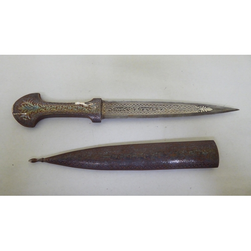 364 - A Persian dagger with a white metal handle and scabbard  the blade 7