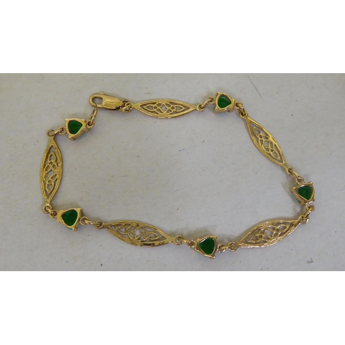 366 - A 9ct gold Irish bracelet, set with green stones