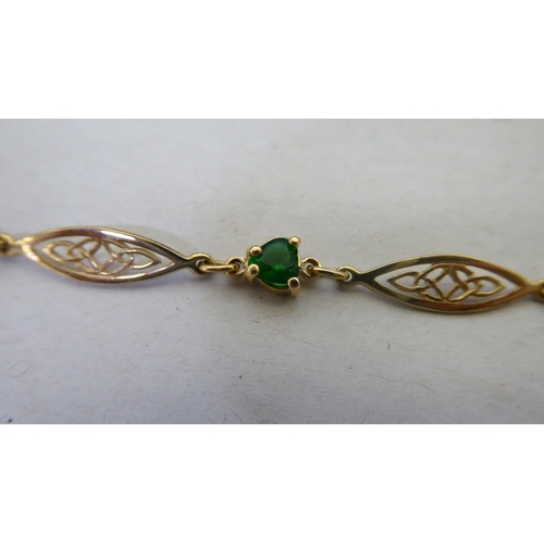 366 - A 9ct gold Irish bracelet, set with green stones