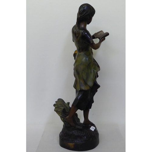 367 - A bronze finished cast metal figure, a young girl reading a book  29