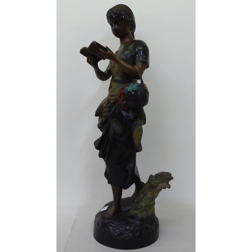 367 - A bronze finished cast metal figure, a young girl reading a book  29