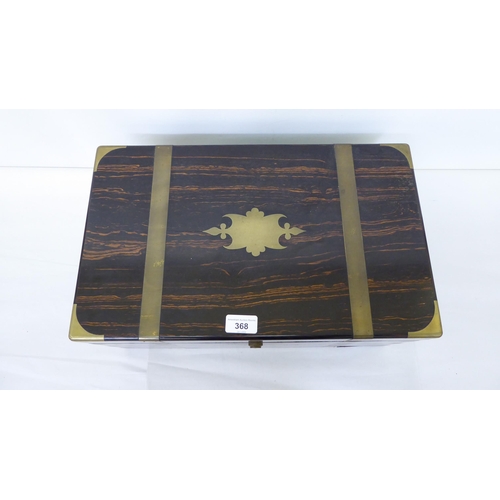 368 - A late Victorian coromandel brass inlaid, military design writing slope with hinged lid, enclosing a... 