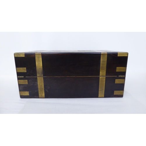 368 - A late Victorian coromandel brass inlaid, military design writing slope with hinged lid, enclosing a... 