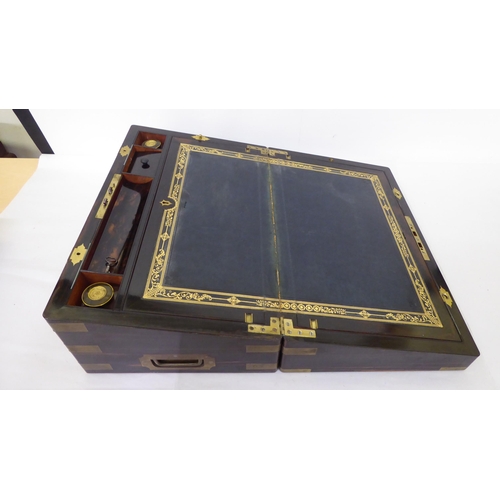 368 - A late Victorian coromandel brass inlaid, military design writing slope with hinged lid, enclosing a... 